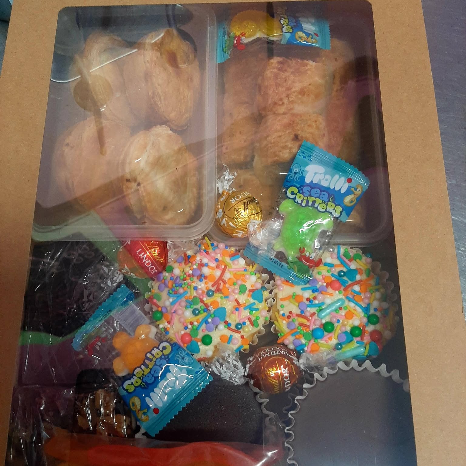 A boxed selection of slices, biscuits and lollies
