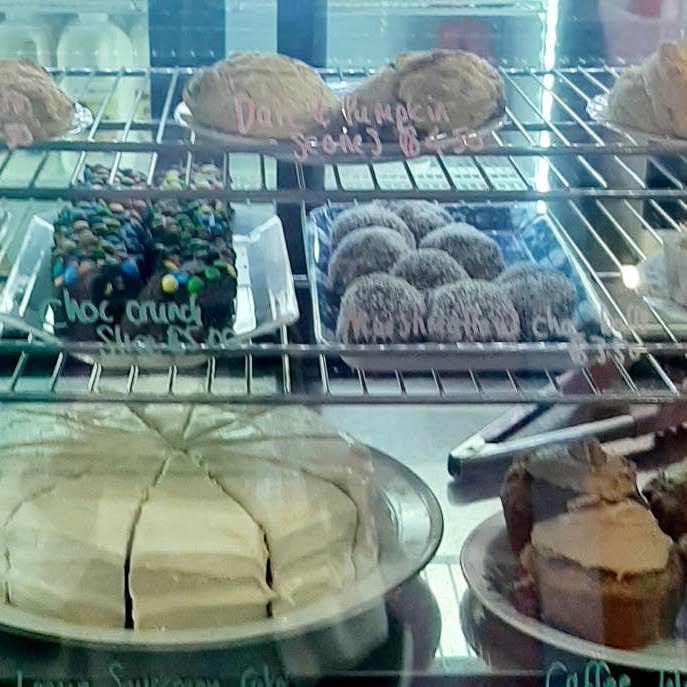 Danish, choc crunch slice and cheesecake in the cabinet
