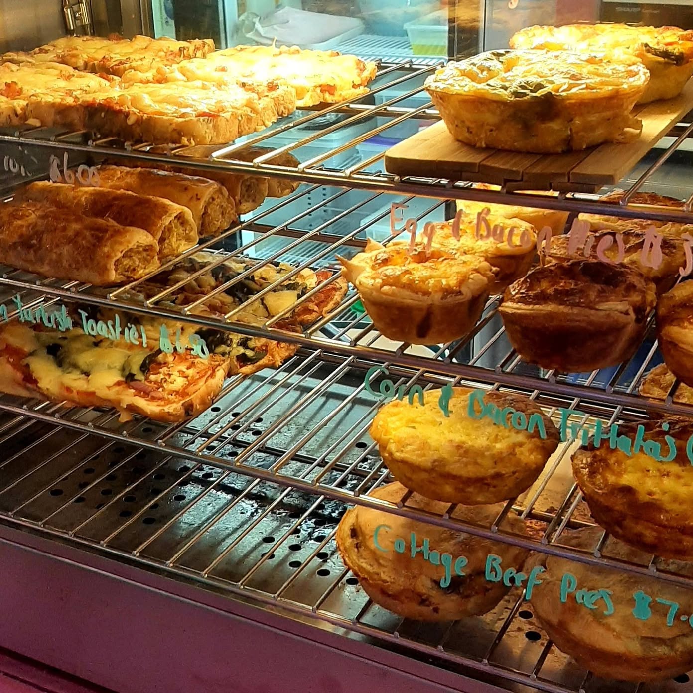 Quiches, egg and bacon pies and cottage beef pies in the hot cabinet