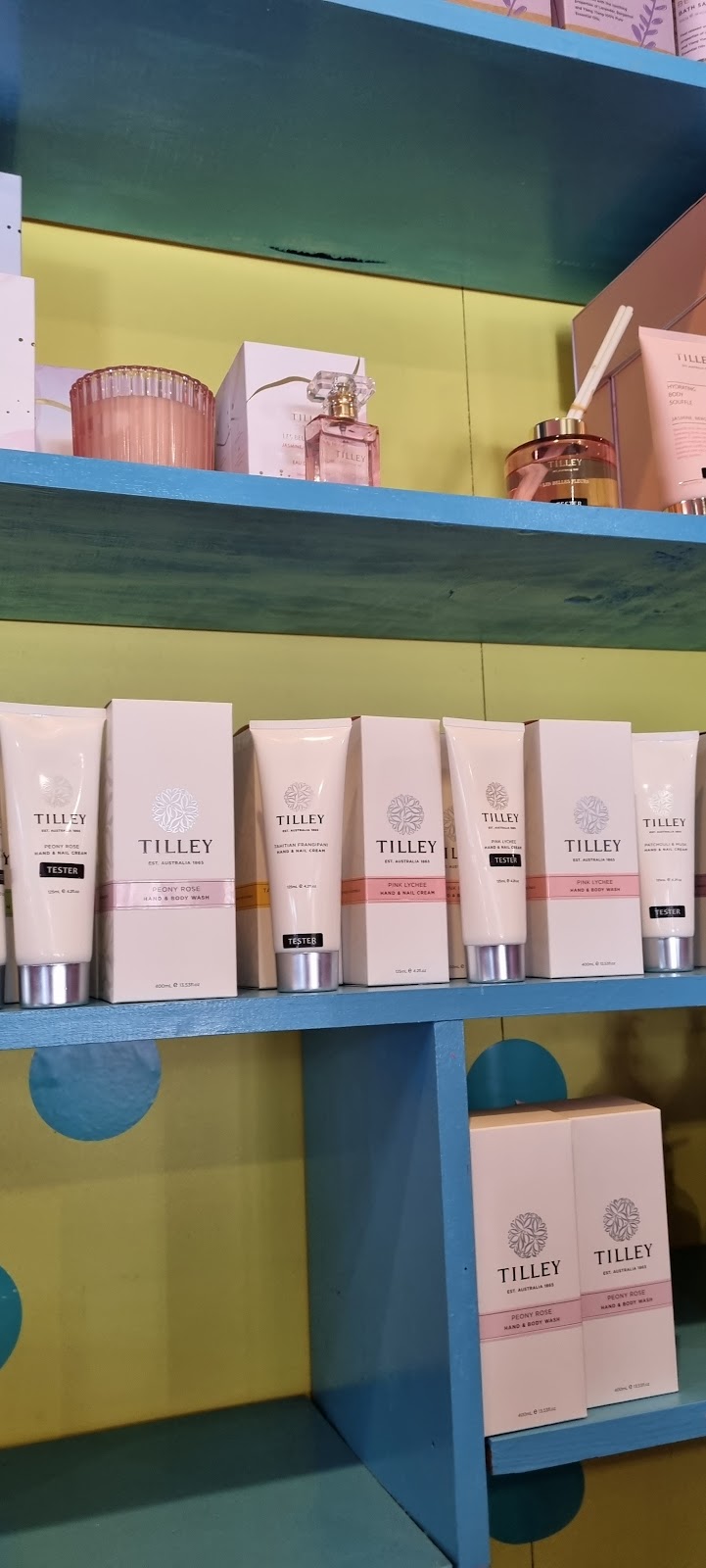 Gift shelves with hand creams, perfume and candles